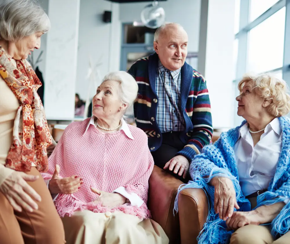 Aged adults having conversation indoors
